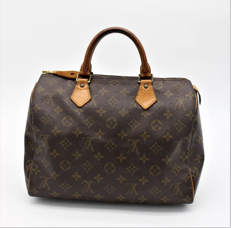 Louis Vuitton crossbody bags with a woven leather strap for textureLOUIS VUITTON Monogram Canvas Speedy 30