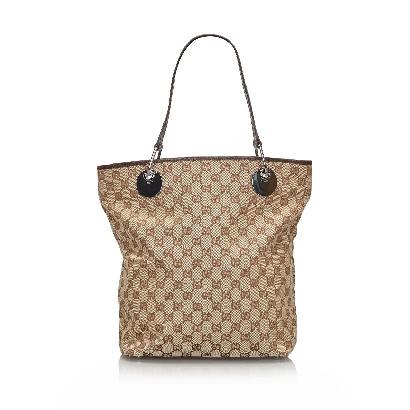 Women Gucci Sylvie bags featuring the signature web stripeGucci Brown Beige Canvas Fabric GG Eclipse Tote Bag Italy