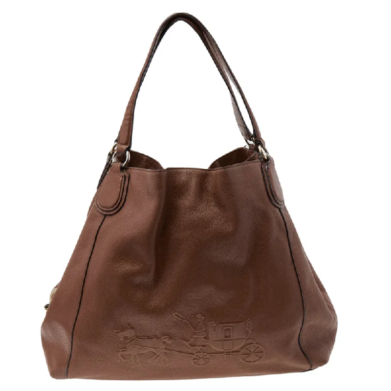 Coach Rogue bags featuring the signature C - hardware for a branded lookBrown Leather Edie Carriage Shoulder Bag