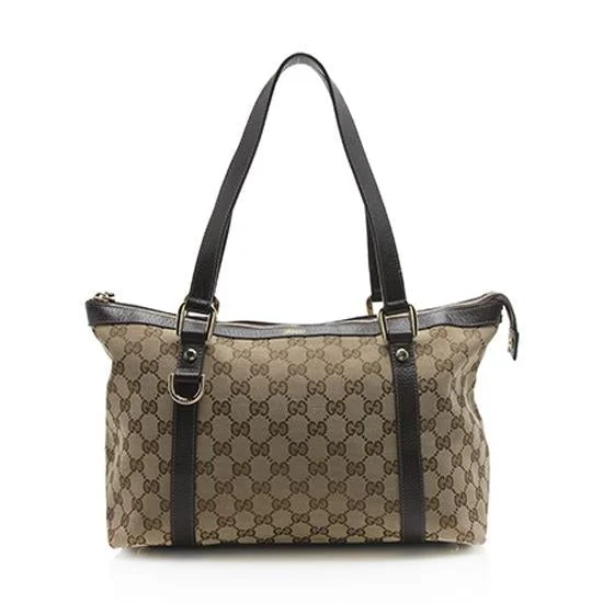 Women Gucci Sylvie bags with a leather - wrapped handleGucci GG Canvas Abbey Medium Tote