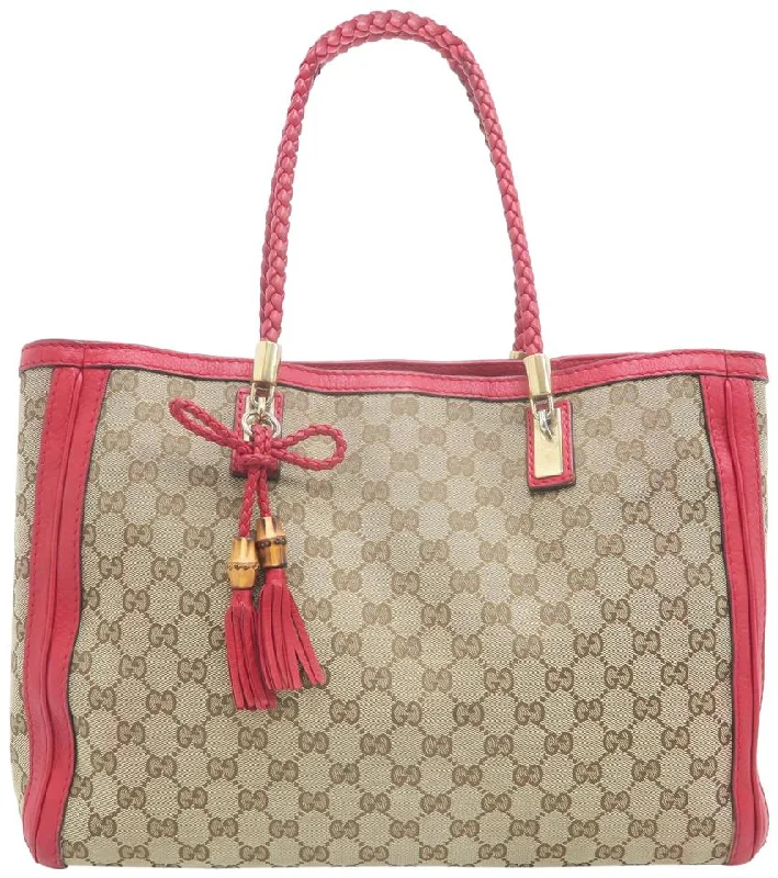 Gucci Marmont bags for women with a contrast - colored interiorGucci Bella Medium Brown Gg Supreme Canvas Tote