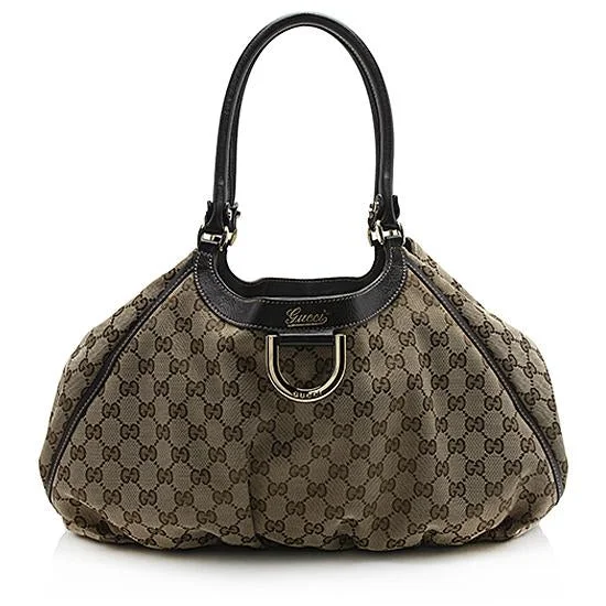 Women Gucci bags with interlocking G hardware for a classic lookGucci GG Canvas Abbey D-Ring Tote