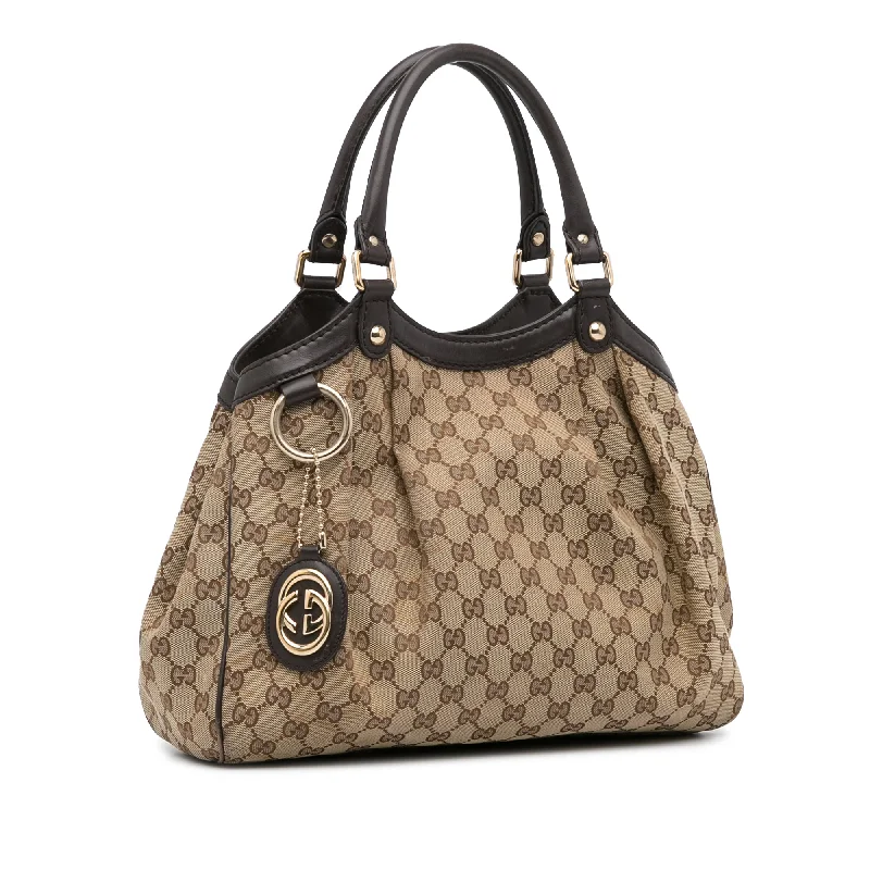 Women Gucci bags with interlocking G hardware for a classic lookBeige Gucci GG Canvas Sukey Tote