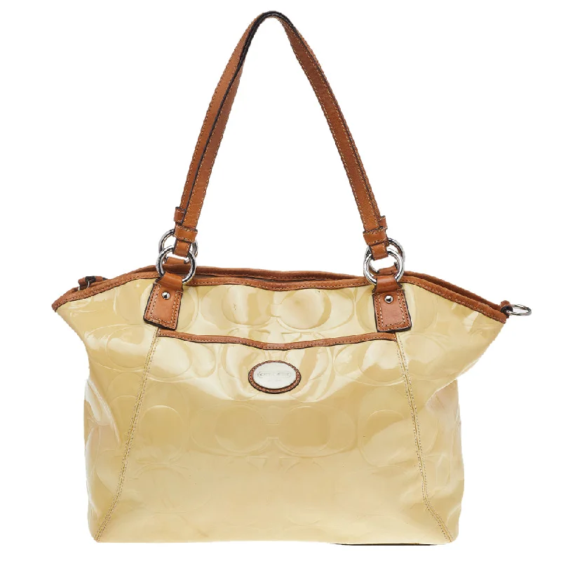 Coach Tabby bags with a classic turnlock closure for a timeless styleCream Signature Patent Leather Peyton Tote