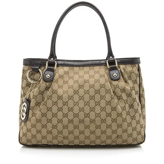 Women Gucci bags with a snap - button closure and a decorative charmGucci GG Canvas Sukey Tote