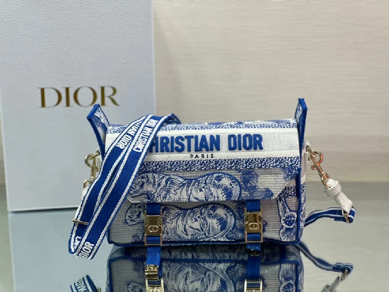 Christian Dior Saddle bags with a studded trim for a bold lookChristian Dior Small DiorCamp Bag